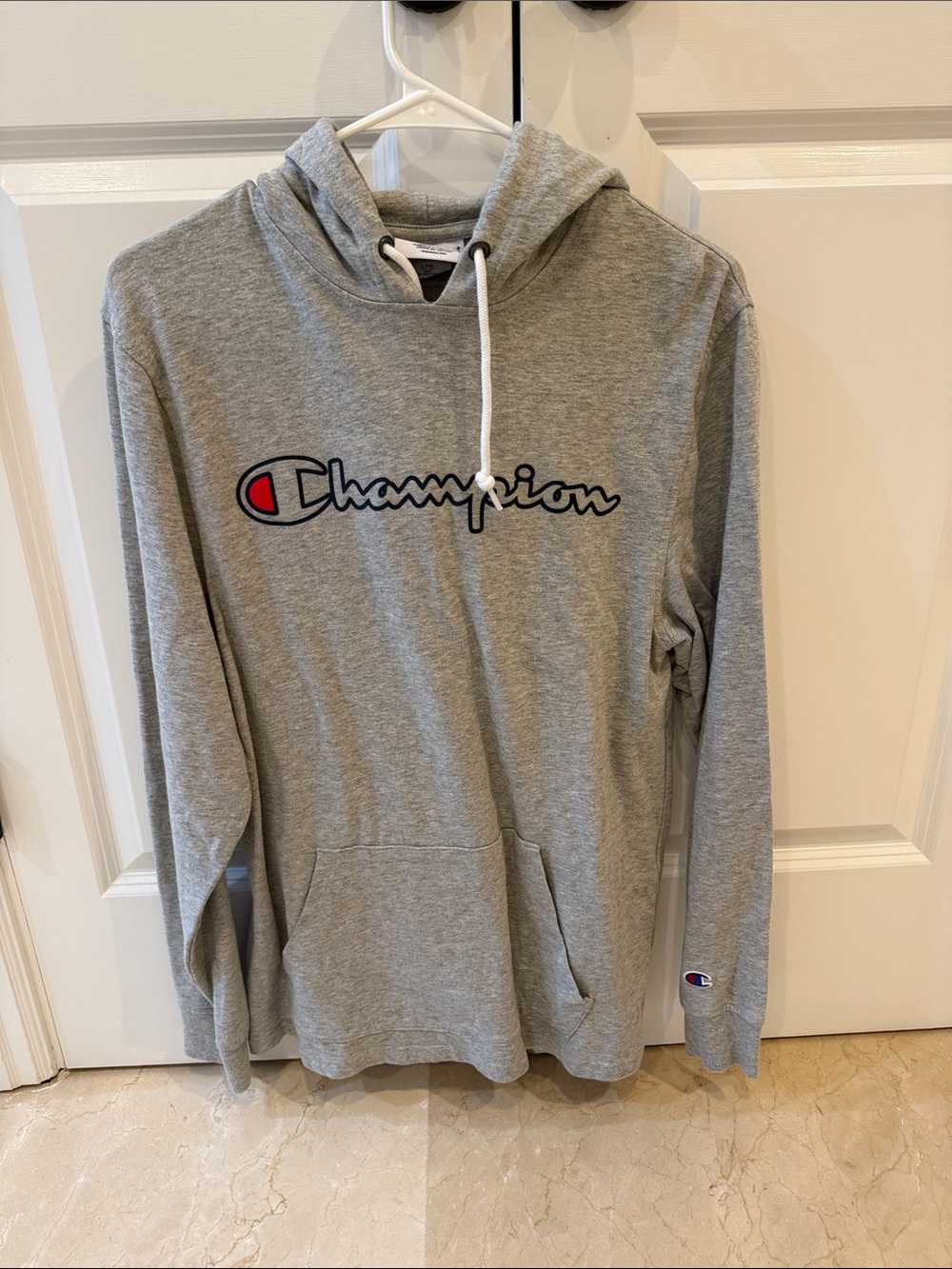 Champion Light Gray Hoodie with Script Logo and Red Accent